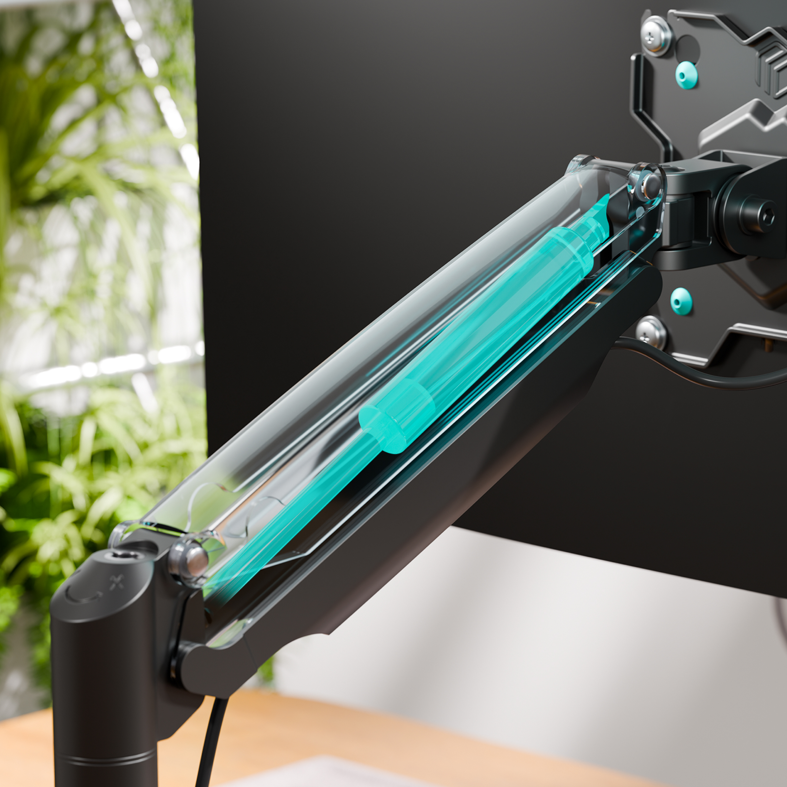 Ramię monitora z gazową sprężyną w przezroczystej obudowie, zielone tło.