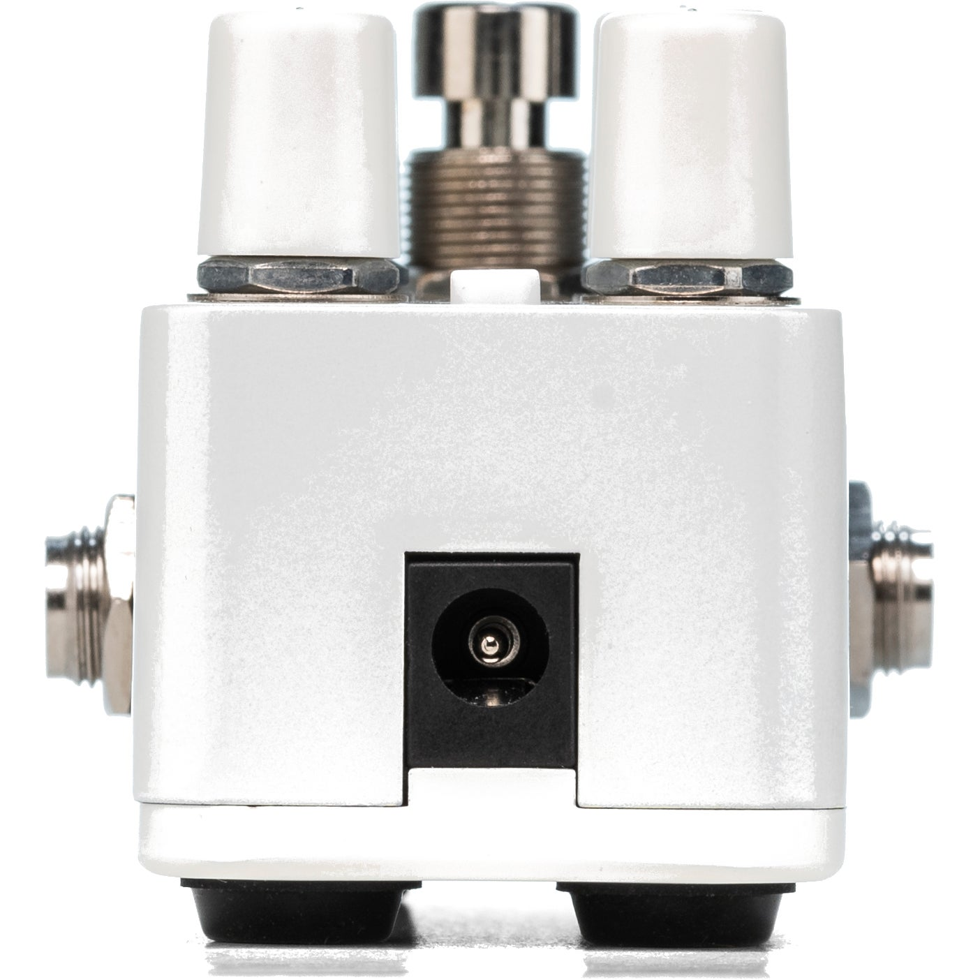 A white guitar pedal with two white knobs, a silver footswitch, and a black DC power jack.