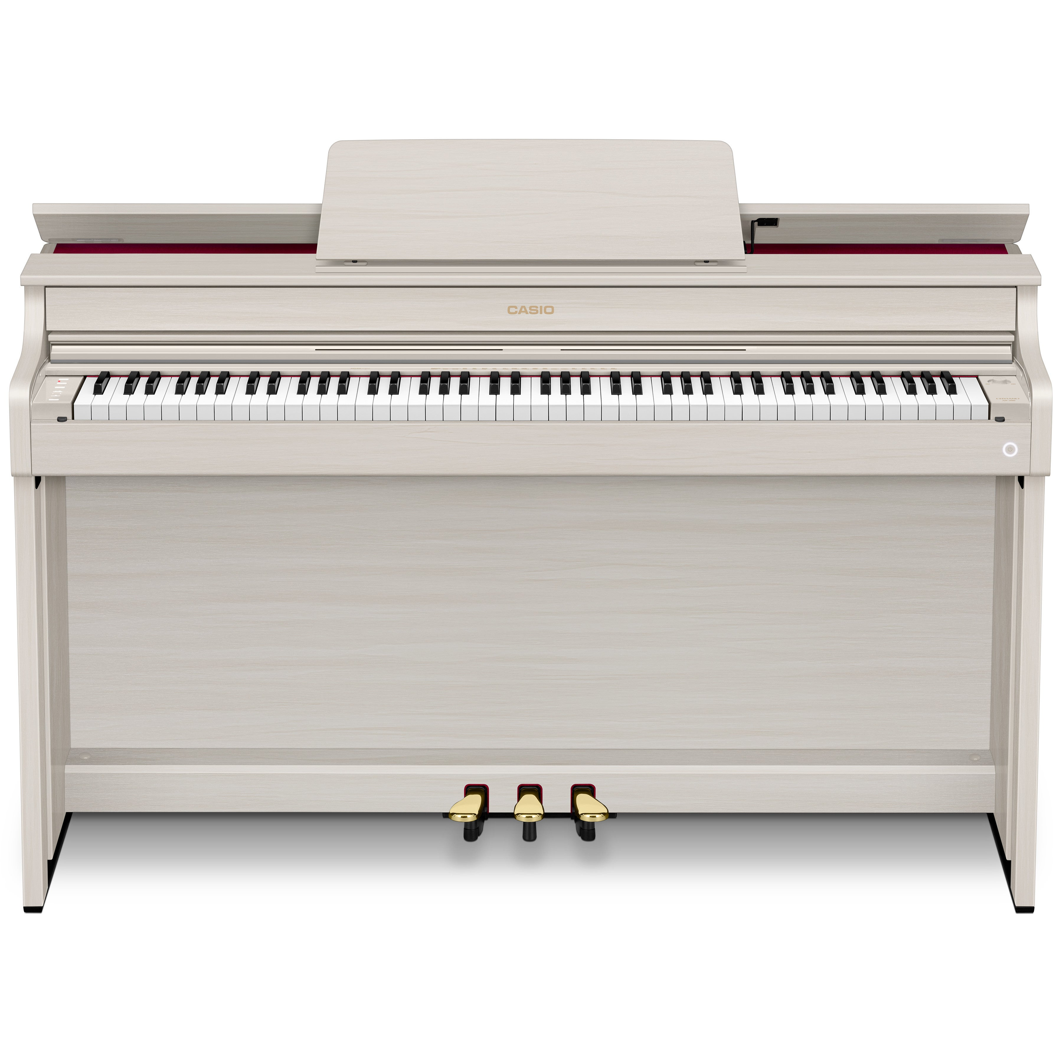 Un piano numérique en bois clair avec clavier et trois pédales.