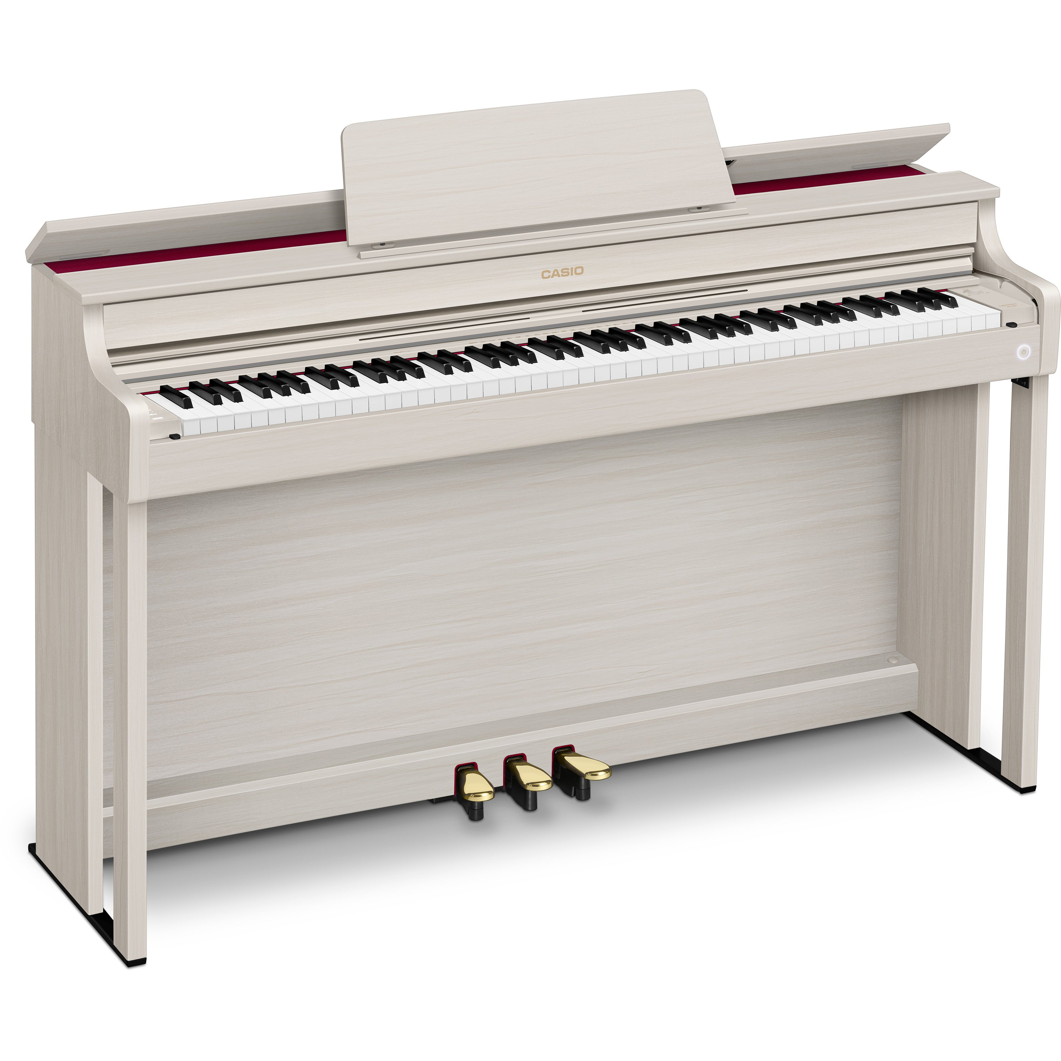 Un piano numérique en bois clair avec des touches noires et blanches et trois pédales.