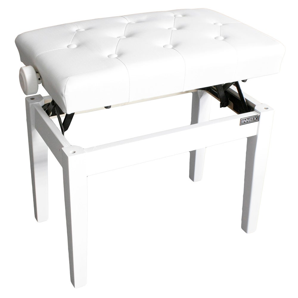 A white upholstered piano bench with adjustable height and button details.