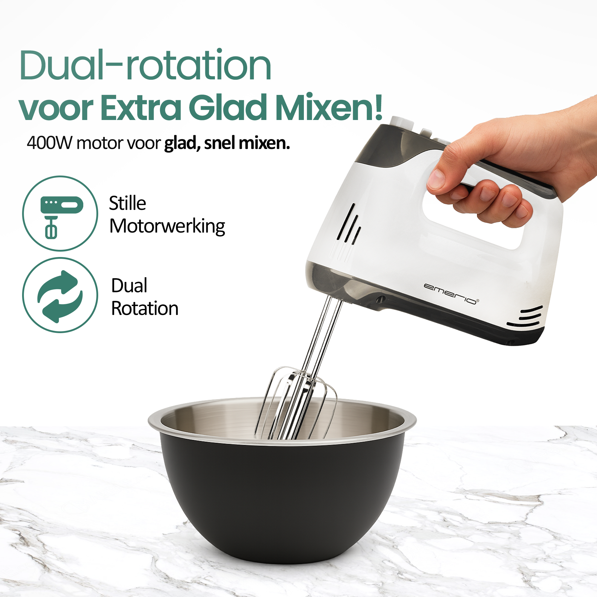 Hand mixer with beaters over a black bowl on a marble surface.