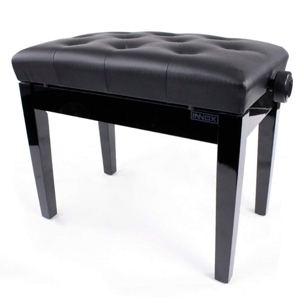 A black, tufted piano bench with a knob on the right side.