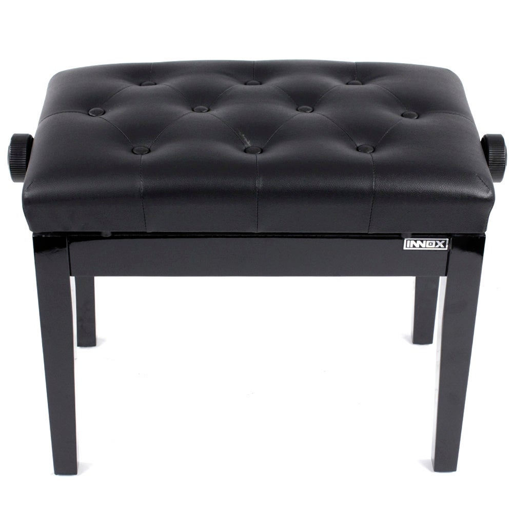 A black, tufted piano bench with height adjustment knobs on the sides.