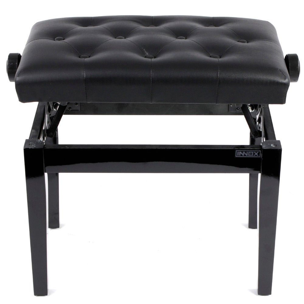 A black, tufted piano bench with adjustable height and knob details.