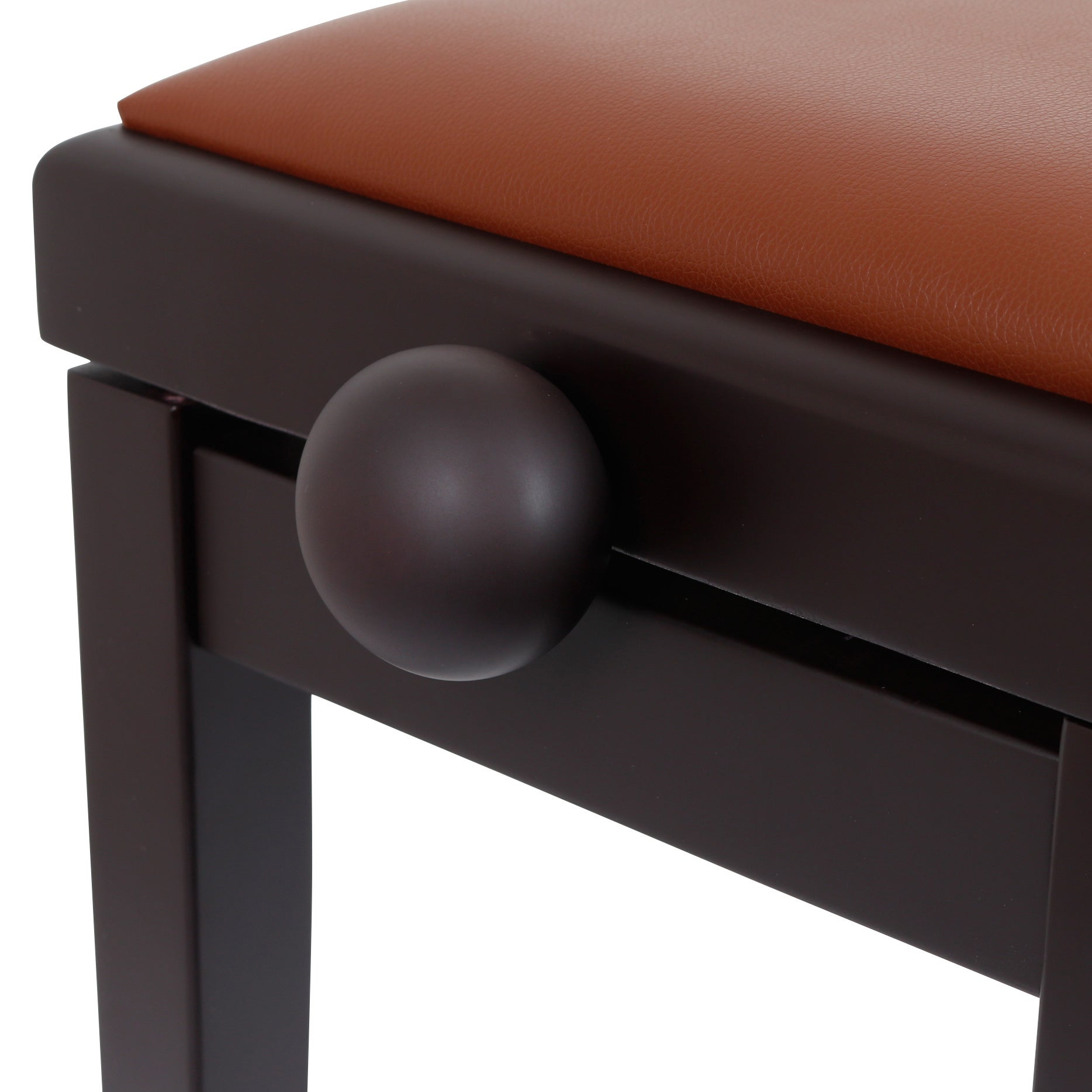 A dark piano bench with a brown seat and a round embellishment.