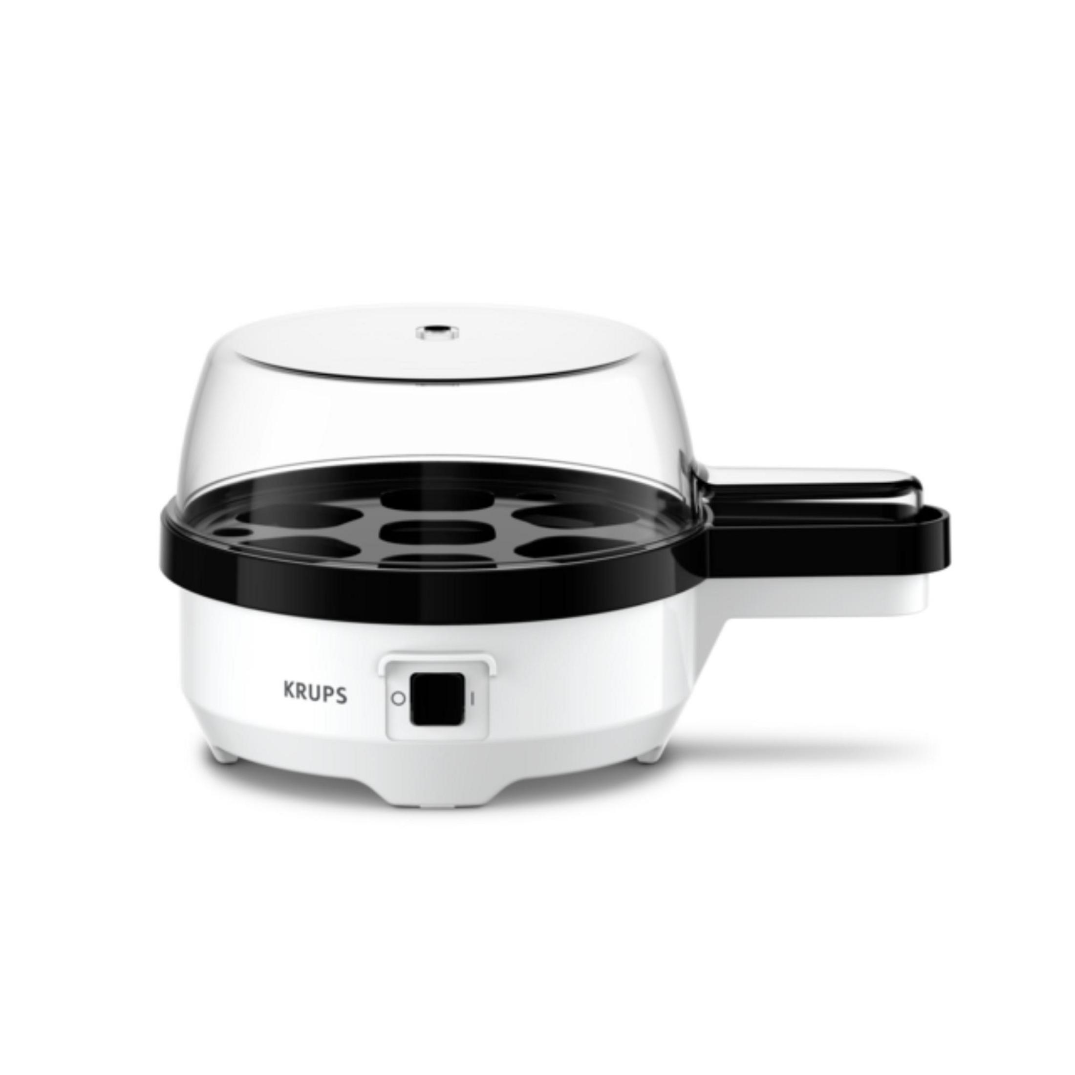 Biała maszynka do gotowania jajek Krups z czarną obręczą i przezroczystą pokrywą.