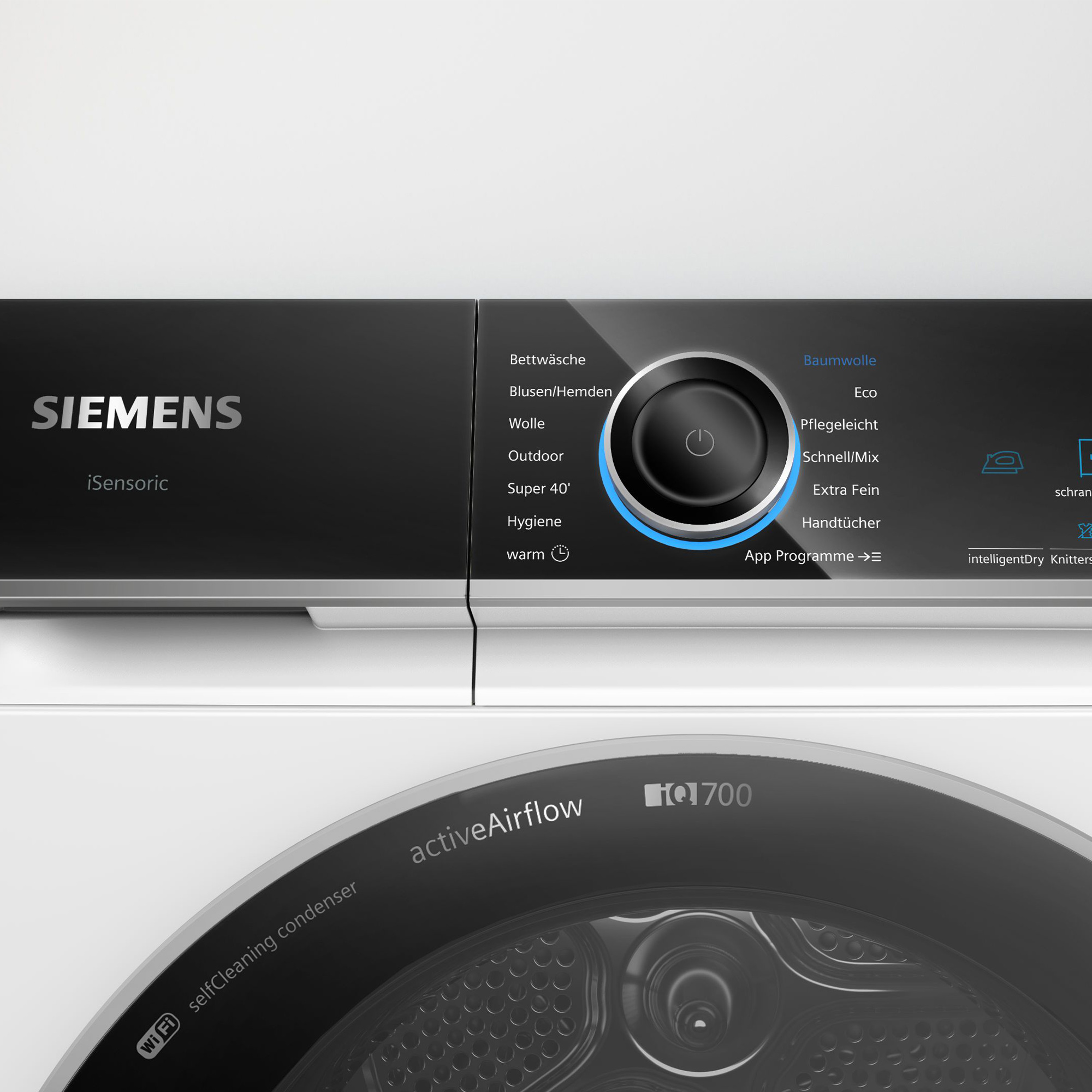 Lavatrice Siemens con display digitale e manopola di controllo. Sono elencati vari programmi di lavaggio.