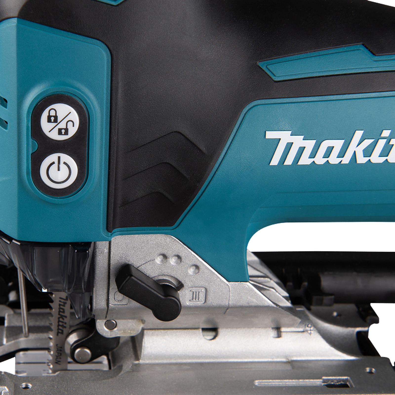 Nahaufnahme einer türkisfarbenen und schwarzen Stichsäge mit Makita-Logo und Bedienelementen.