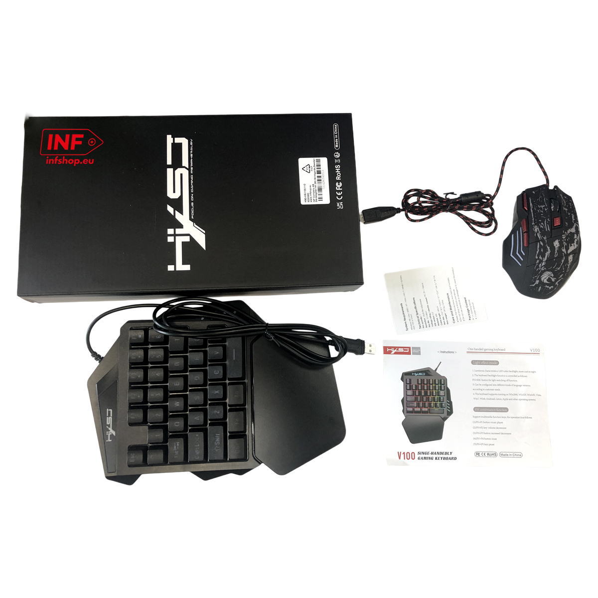 Ein schwarzer Gaming-Keyboard und eine Maus liegen neben einer schwarzen Verpackung.