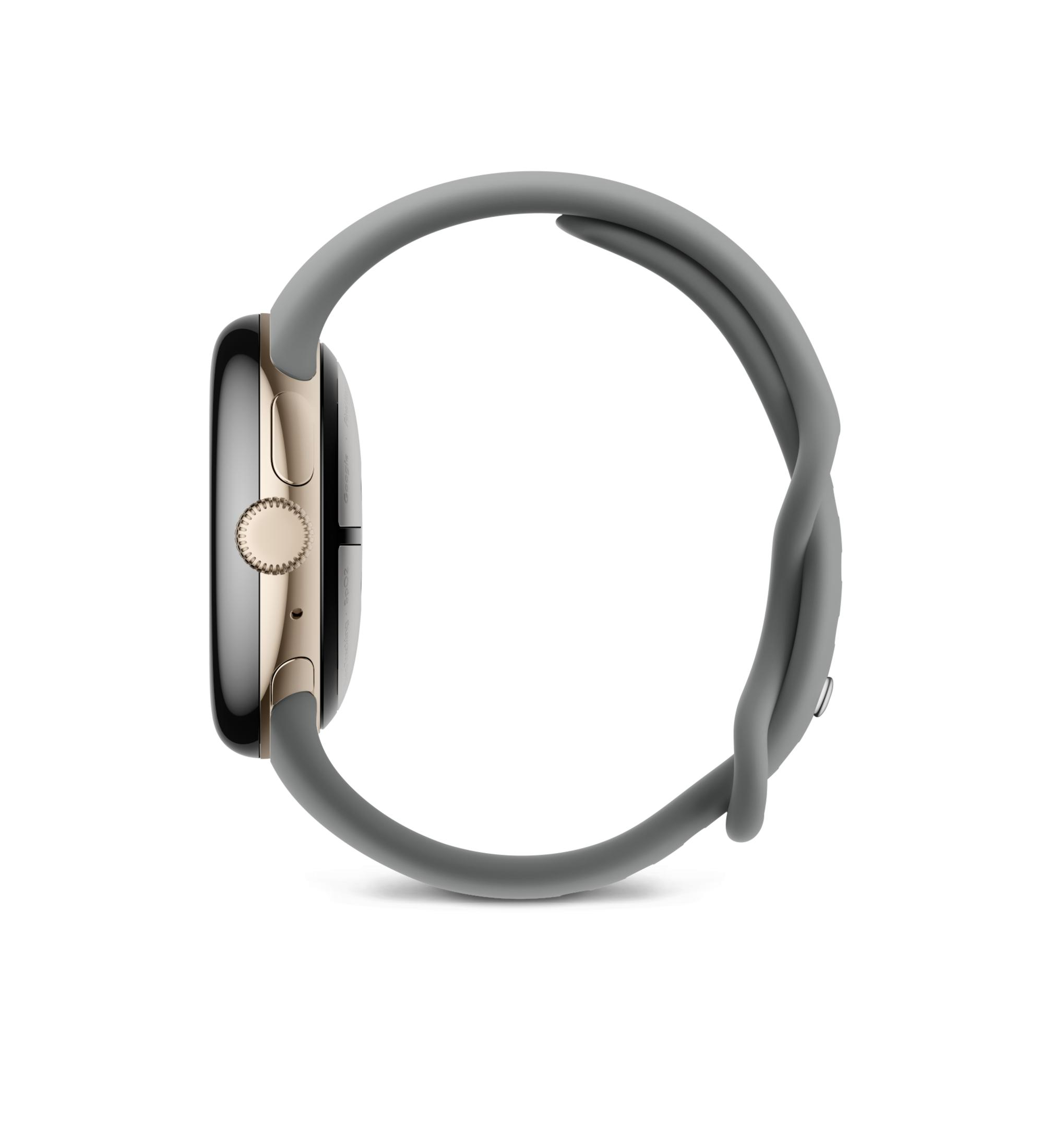 Szary smartwatch ze złotą obudową i koroną na białym tle.