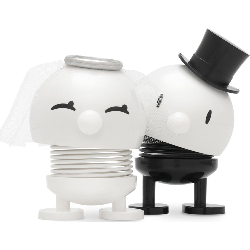Due figure bianche come sposa e sposo con molle.
