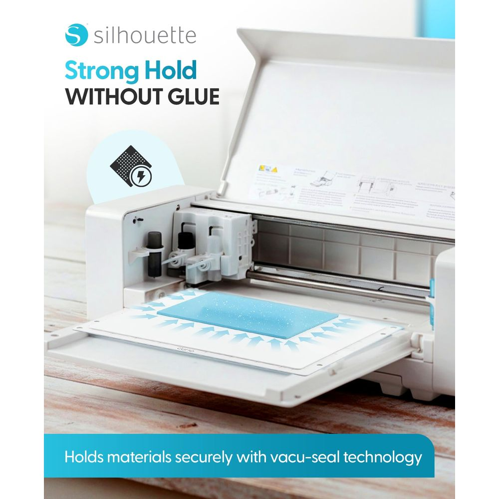 Machine de découpe Silhouette avec tapis bleu tenant le matériau. Technologie vacu-seal.