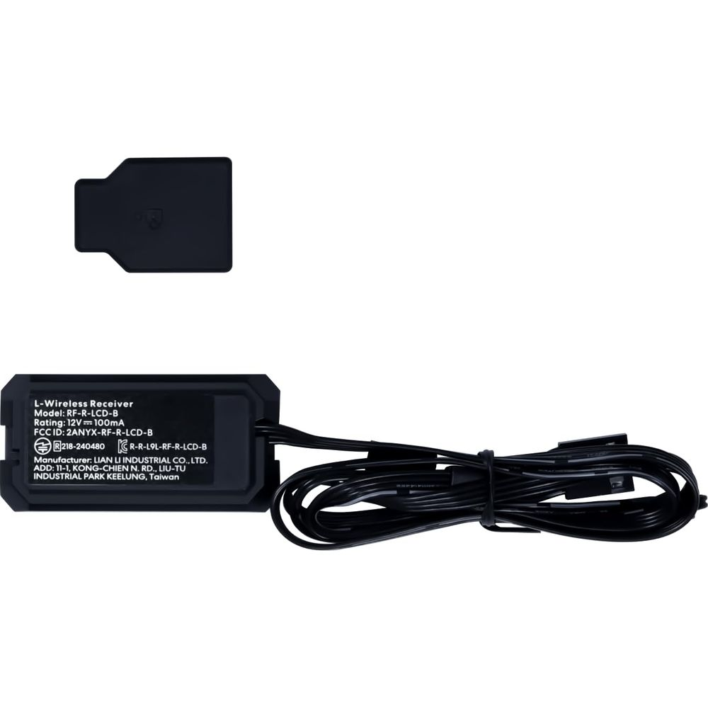 Ein schwarzer L-Wireless Receiver mit Kabeln und ein schwarzer Deckel.