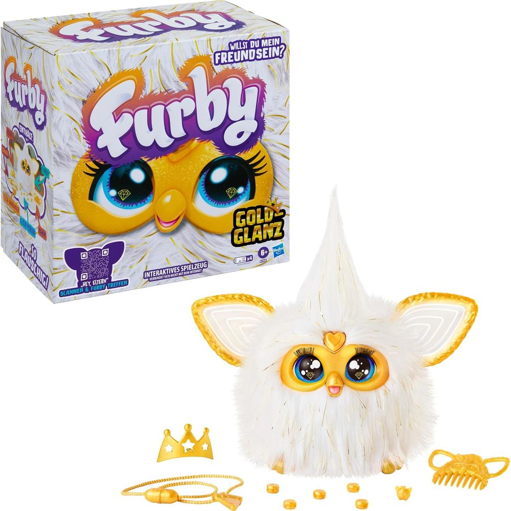 Ein weißer Furby mit goldenen Akzenten, Spielzeugbox und Accessoires.