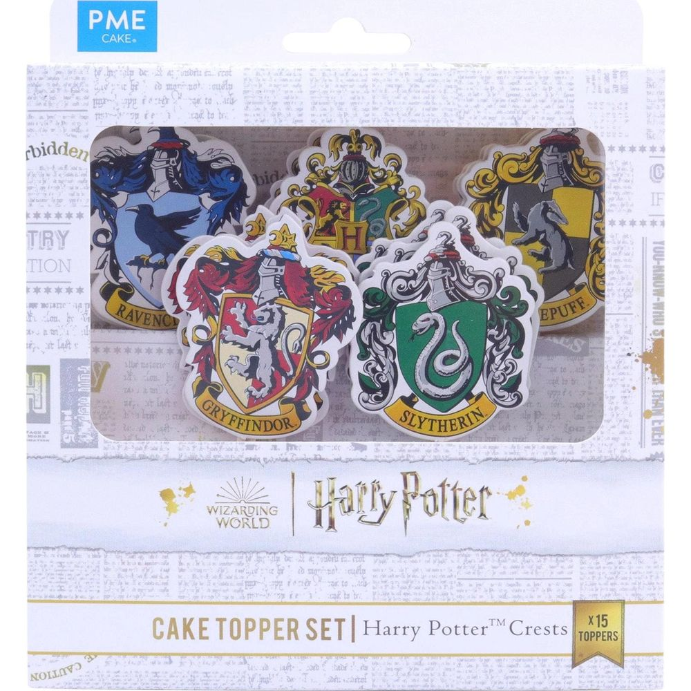 Verpackung mit Harry Potter Tortenauflegern mit Hauswappen: Gryffindor, Slytherin, Ravenclaw, Hufflepuff.