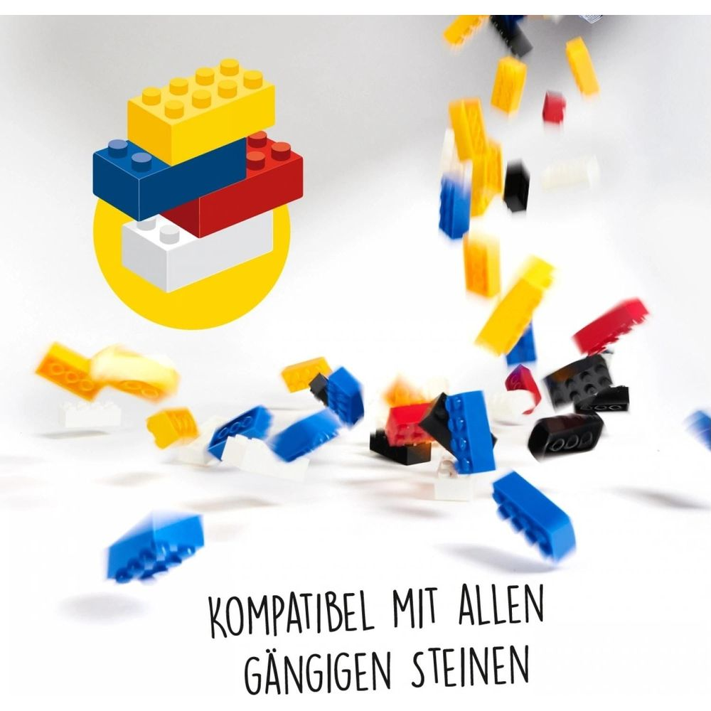 Des blocs de construction colorés tombent et s'empilent sur un cercle jaune.