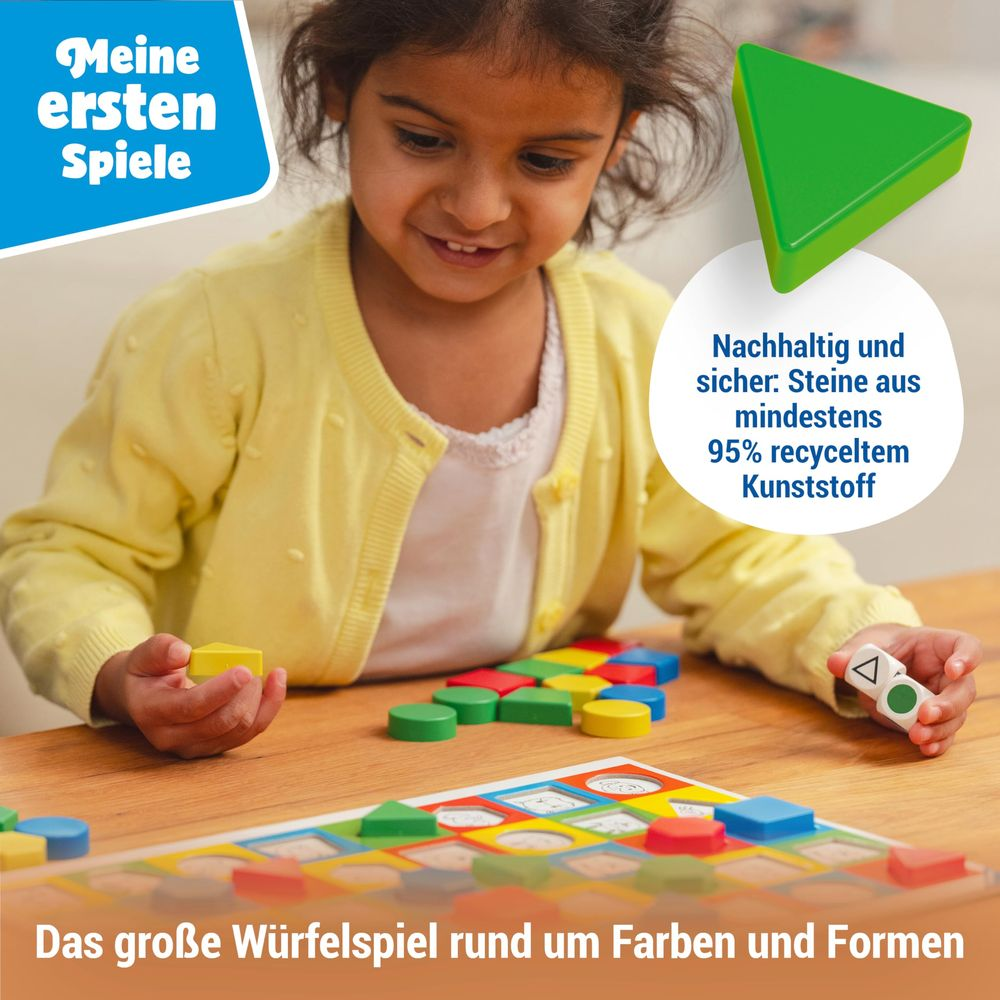 Una bambina gioca con blocchi colorati e un tabellone di gioco in plastica riciclata.