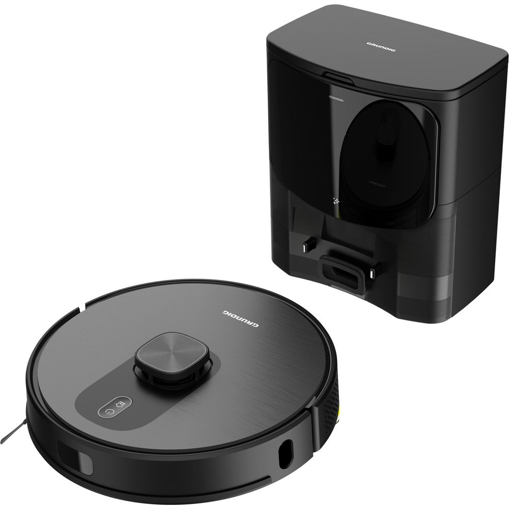 Un robot aspirateur rond noir et une station de charge noire.