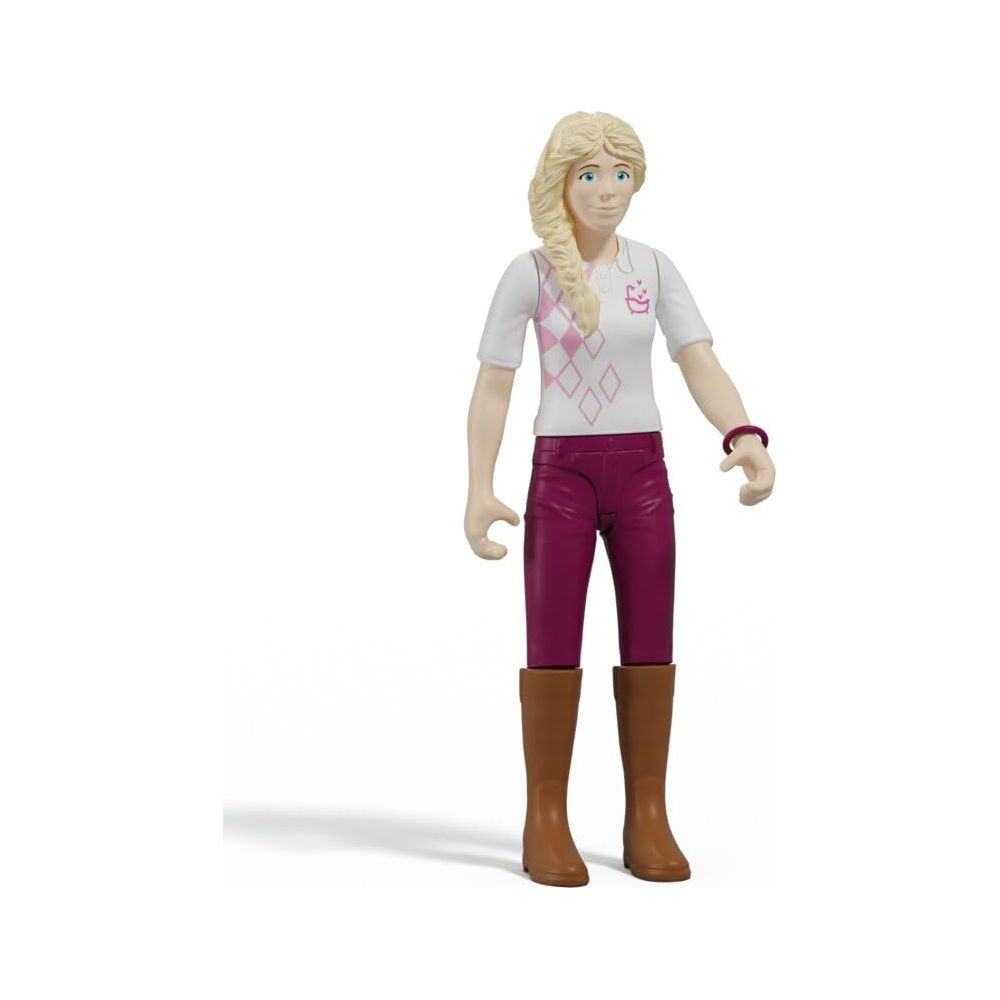 Blonde Puppe mit blauen Augen, trägt pink-weißes Poloshirt und lila Hose.