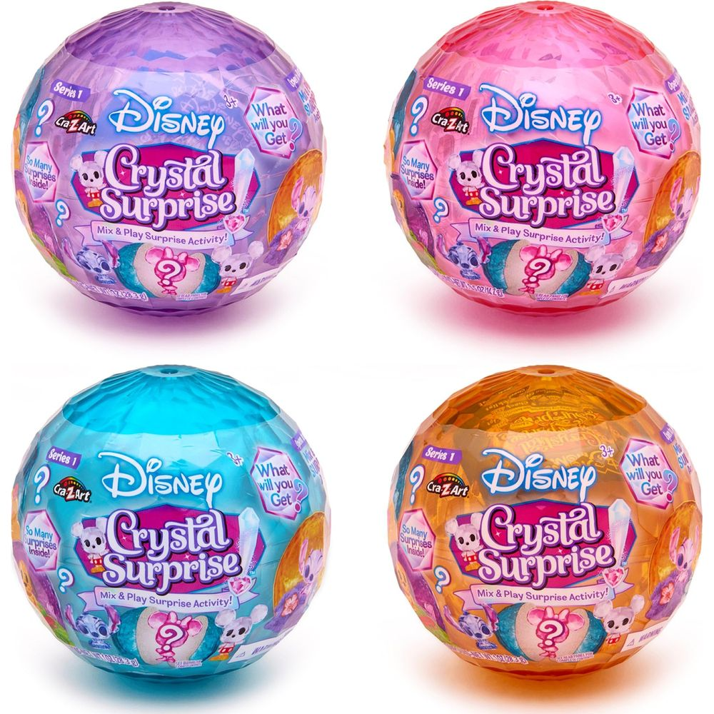 Quatre jouets Disney Crystal Surprise de couleur violette, rose, bleue et orange.