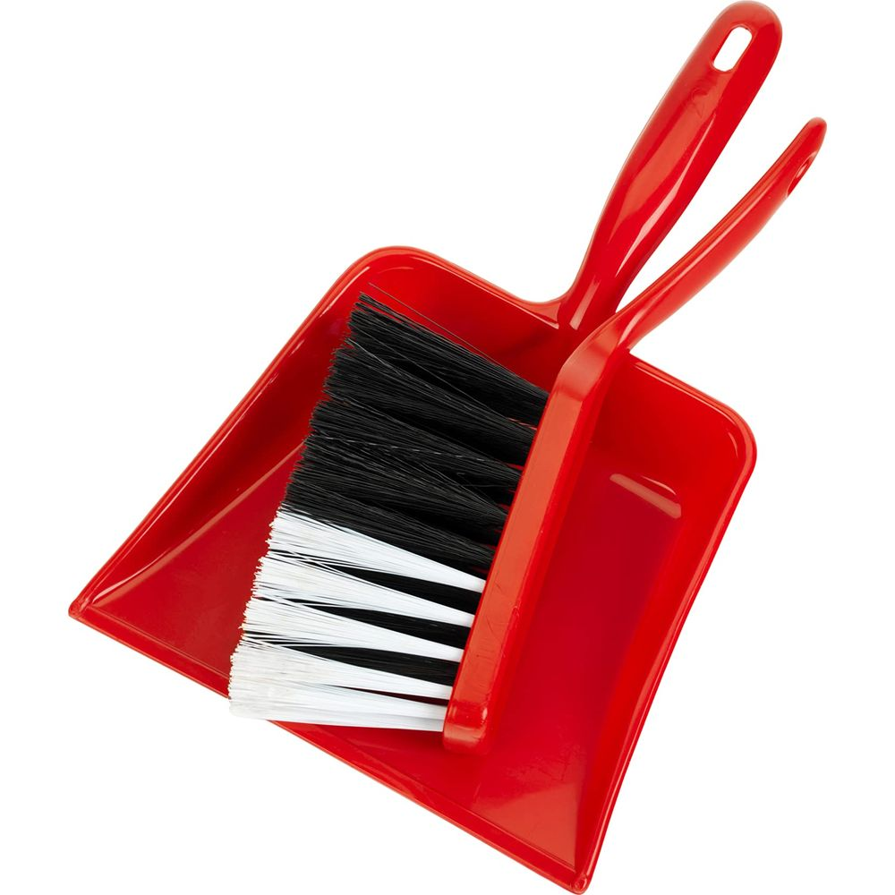 Una paletta e una scopola rosse con setole nere e bianche.