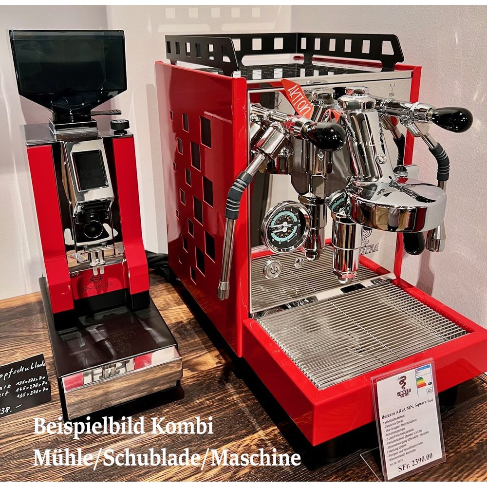 Machine à expresso rouge et moulin à café sur table en bois.