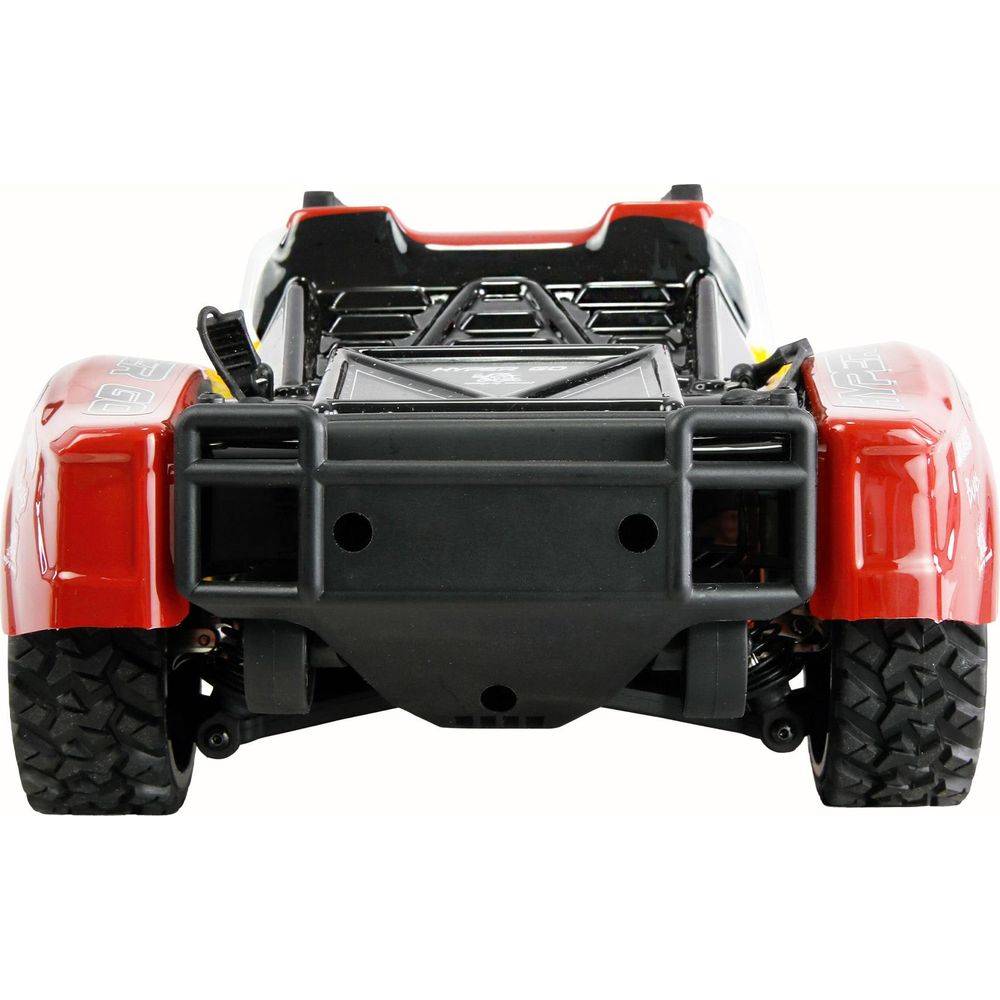 Ein rotes ferngesteuertes Auto mit schwarzem Überrollkäfig und Reifen.