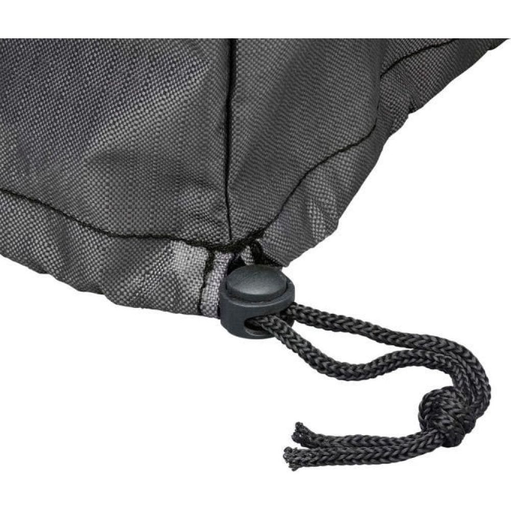 Ein schwarzer Kordelstopper mit zwei Kordeln, die durch ihn hindurchgeführt sind.