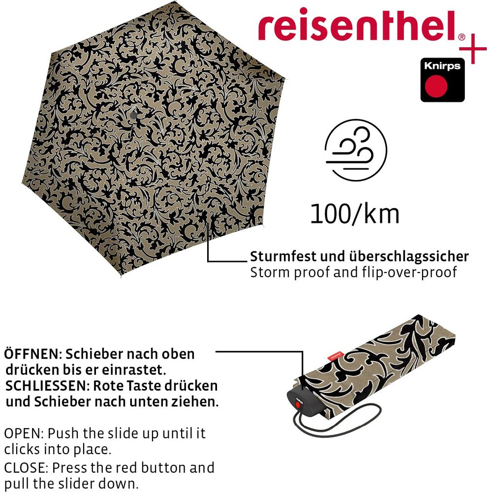 Ein geschlossener Regenschirm mit Muster, der Sturm- und Wende-sicher ist.