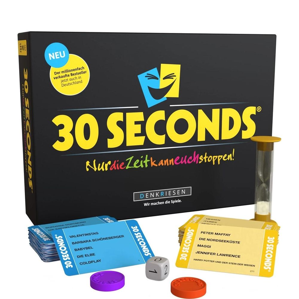 Das Spiel "30 Sekunden" mit Kartenstapeln, Würfel, Spielfiguren und Sanduhr.