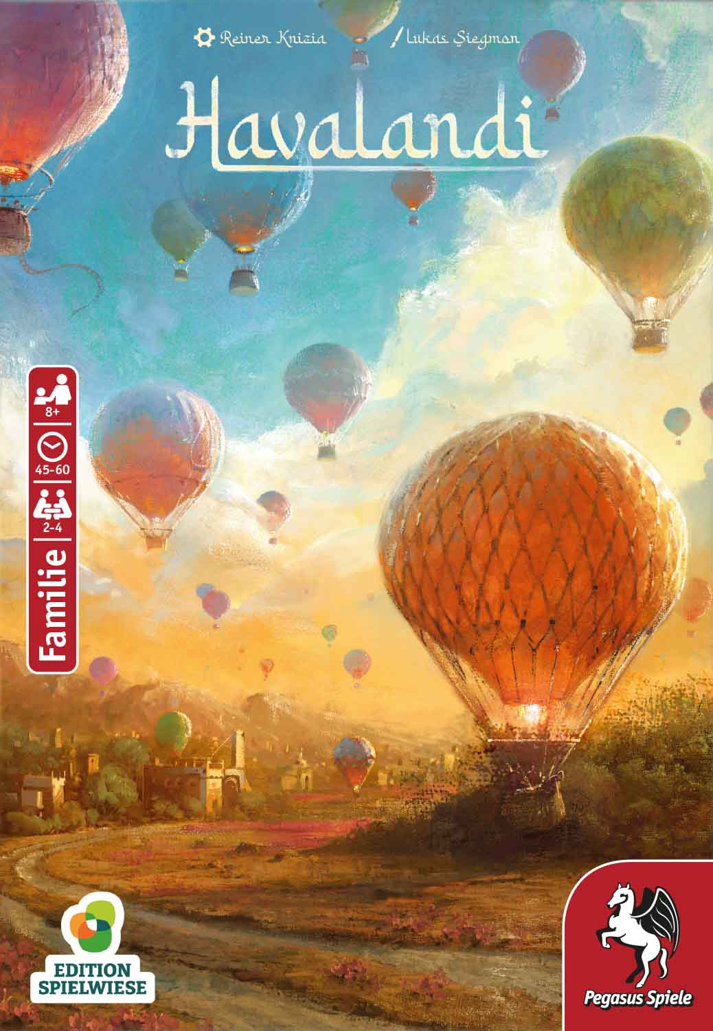Heißluftballons schweben über einer Landschaft mit Gebäuden und Bäumen.