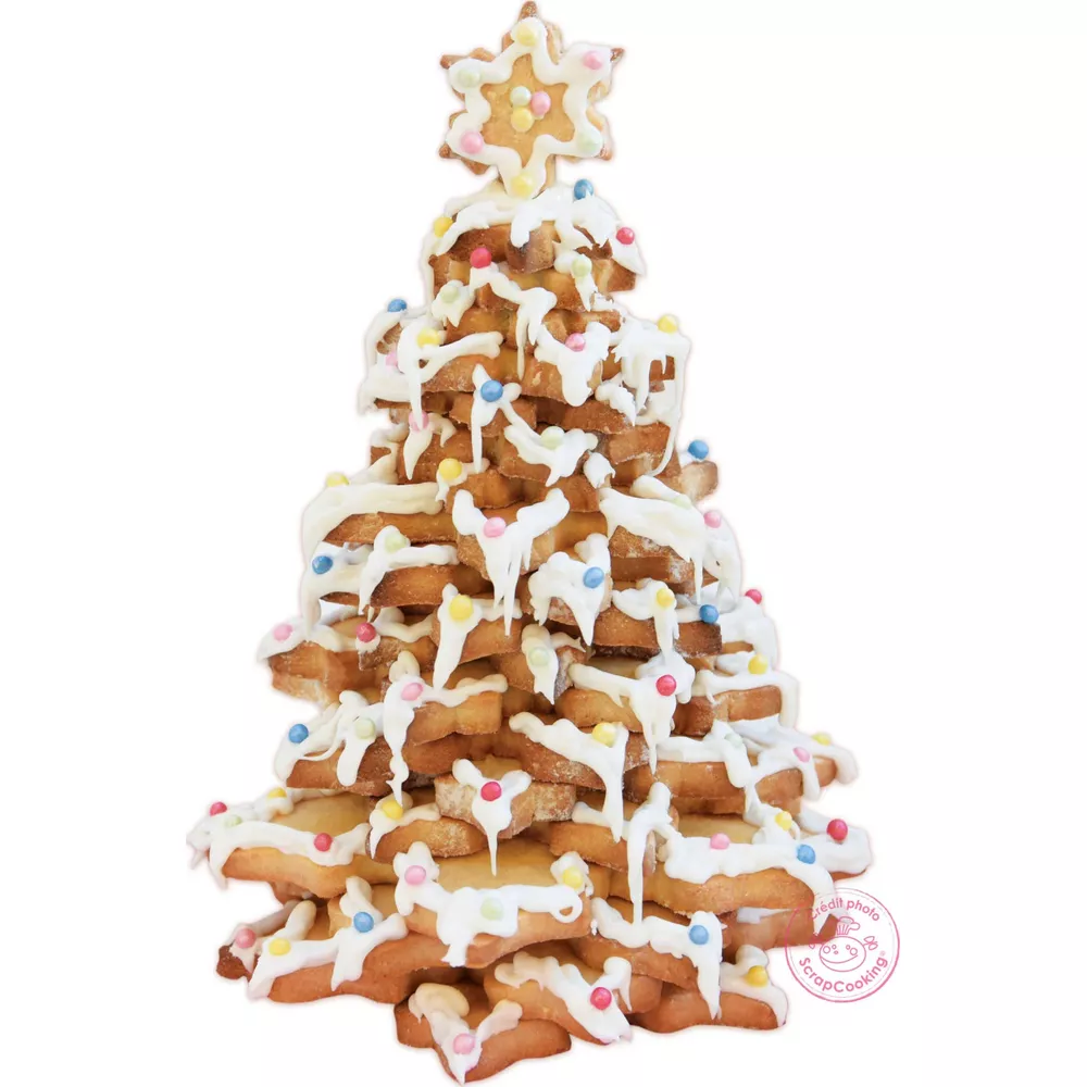 Ein Lebkuchenhaus-Baum mit weißer Glasur und bunten Streuseln, auf weißem Hintergrund.