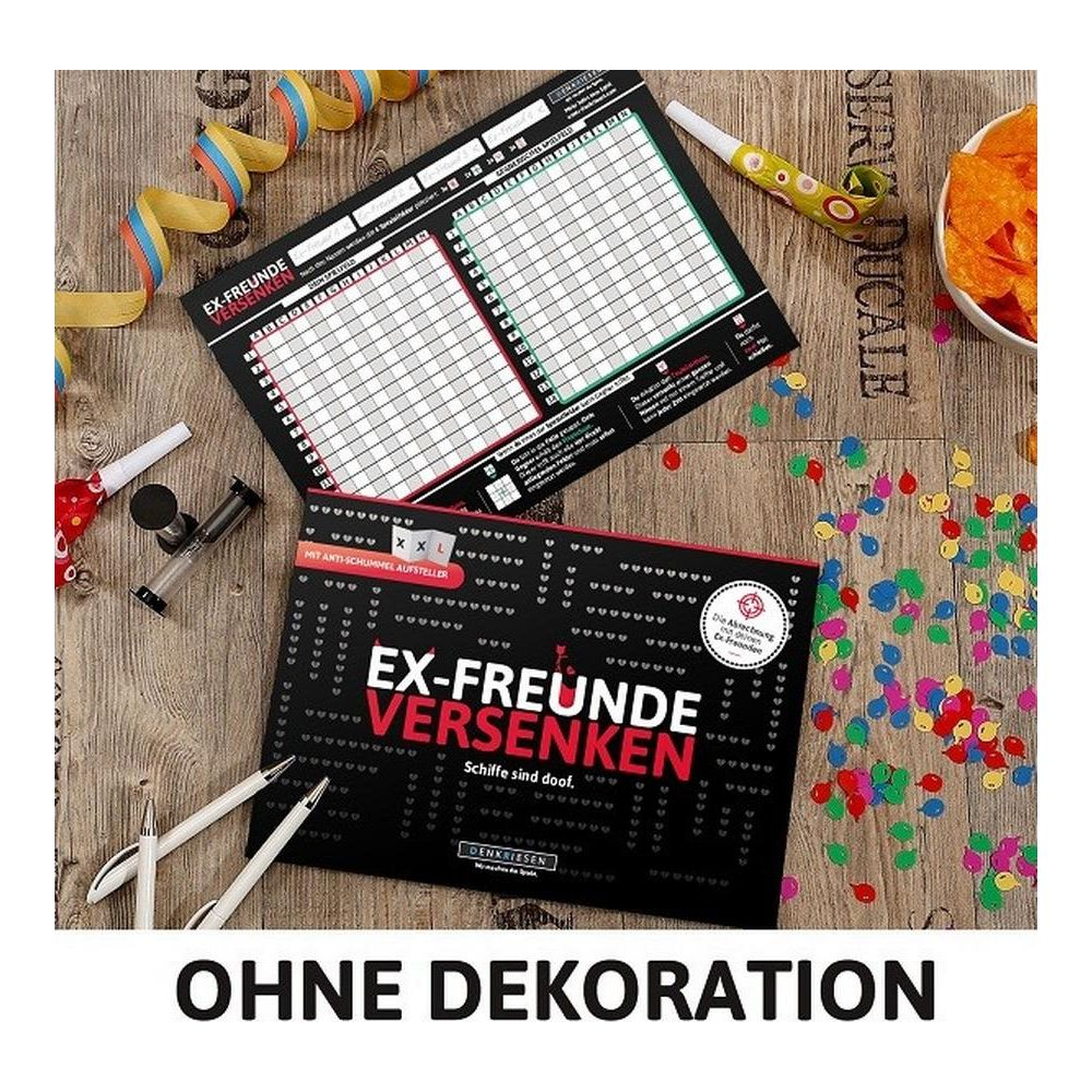 Zwei Spiele "Ex-Freunde versenken" liegen auf einem Holztisch mit Konfetti.