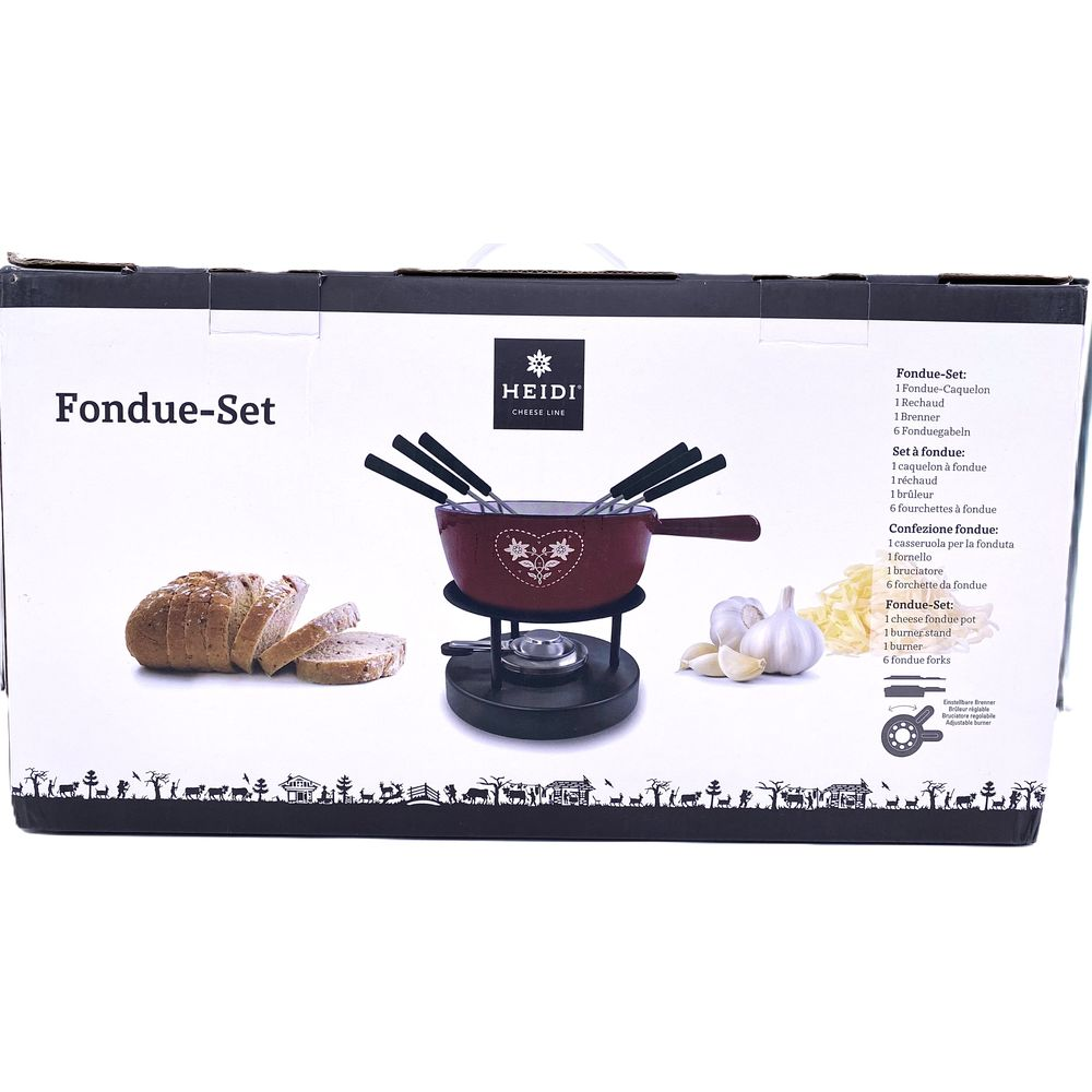 Un set da fondue rosso con pane, aglio e formaggio su una scatola.