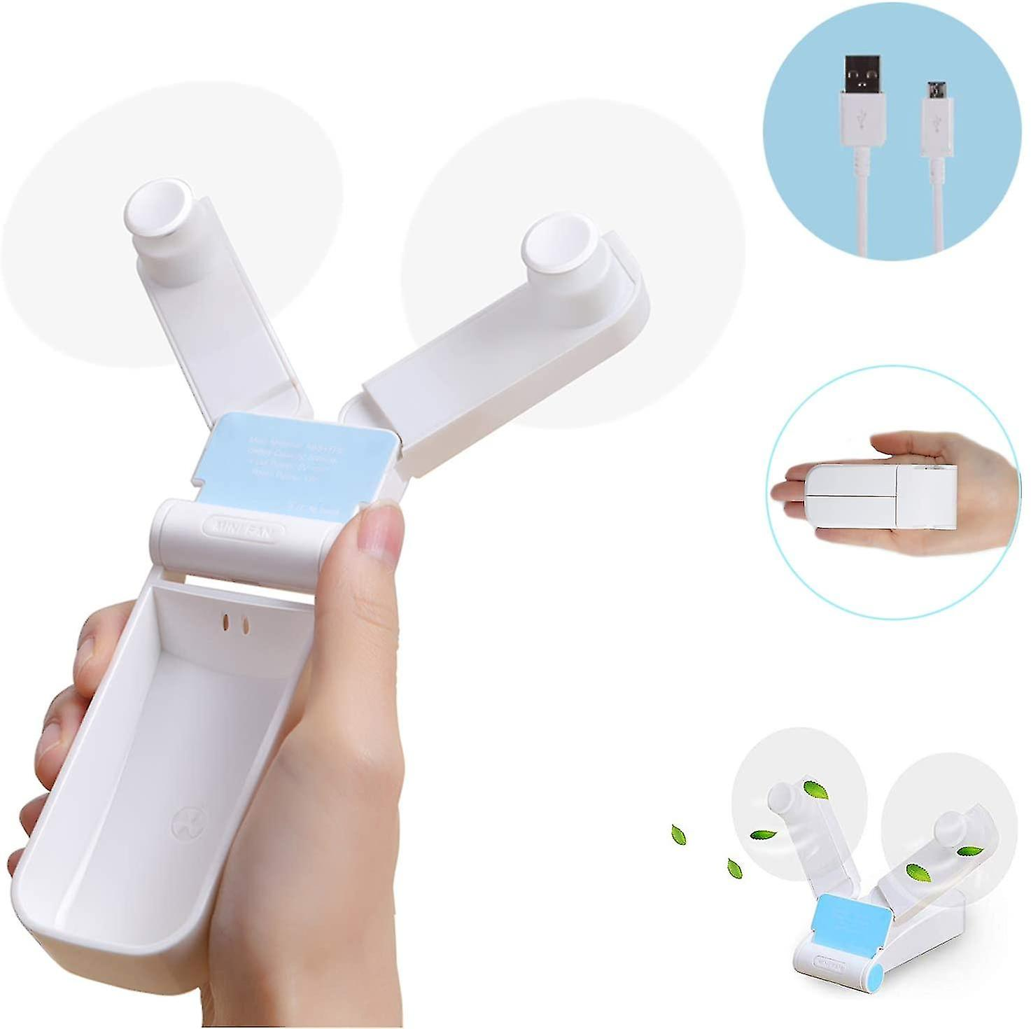 Ein weißer Mini-Ventilator mit zwei Flügeln wird in einer Hand gehalten.