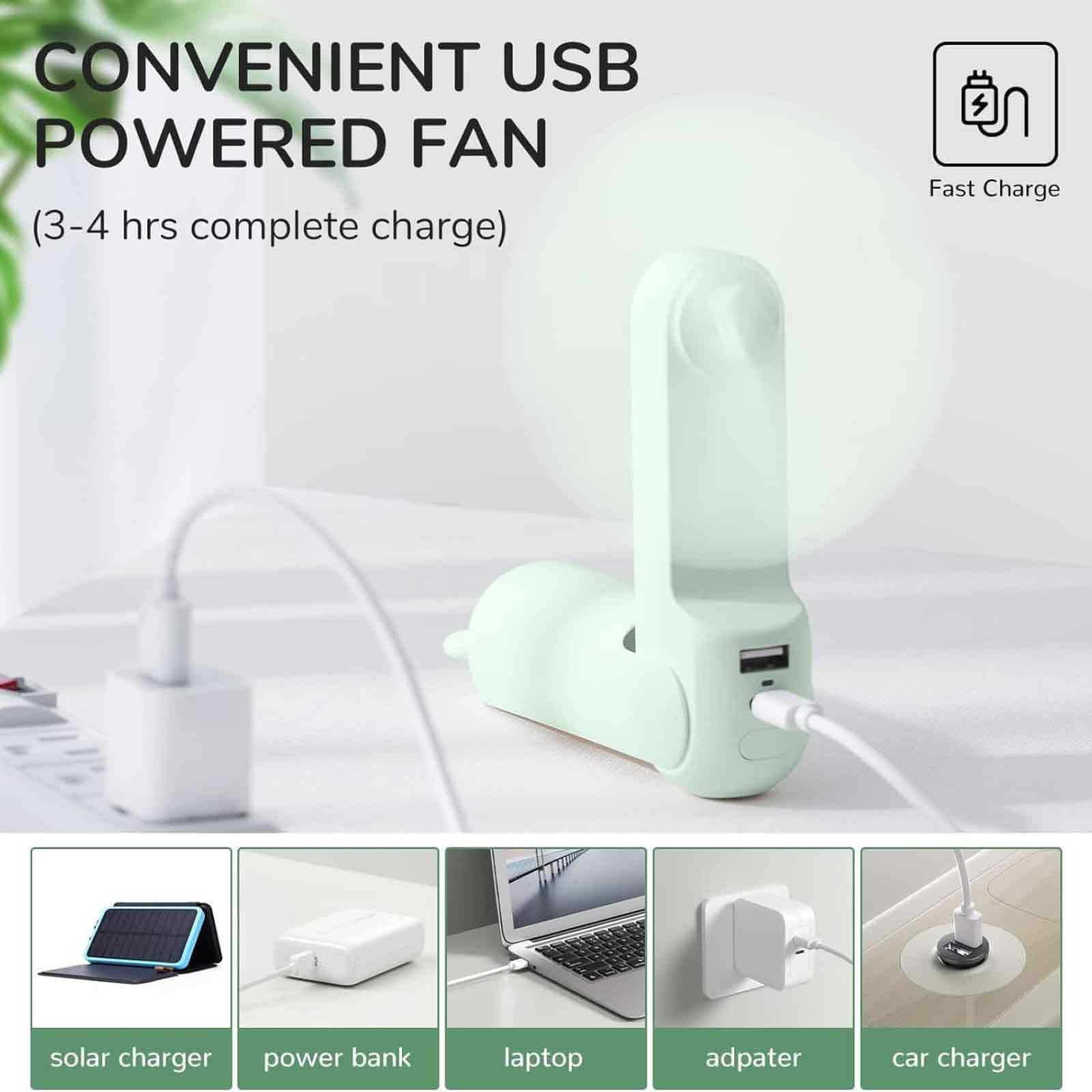 Ein hellgrüner USB-Ventilator mit Schnallladefunktion, der an ein Netzteil angeschlossen ist.