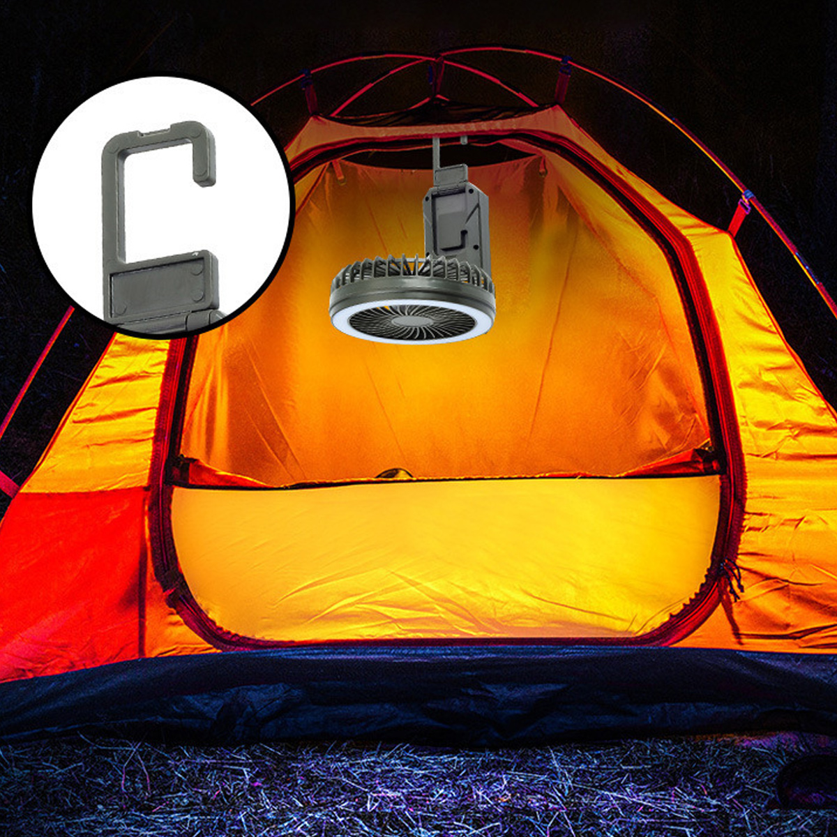 Ein Campinglüfter mit Licht hängt in einem beleuchteten Zelt.