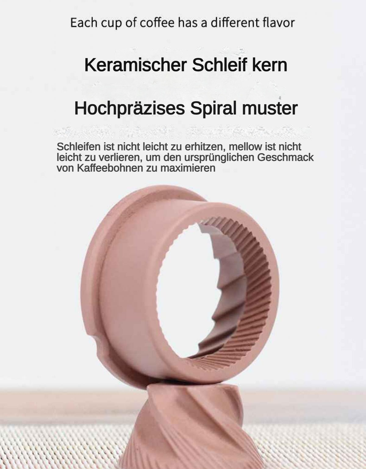 Eine rosafarbene Keramik-Kaffeemühle mit Spiralmuster.