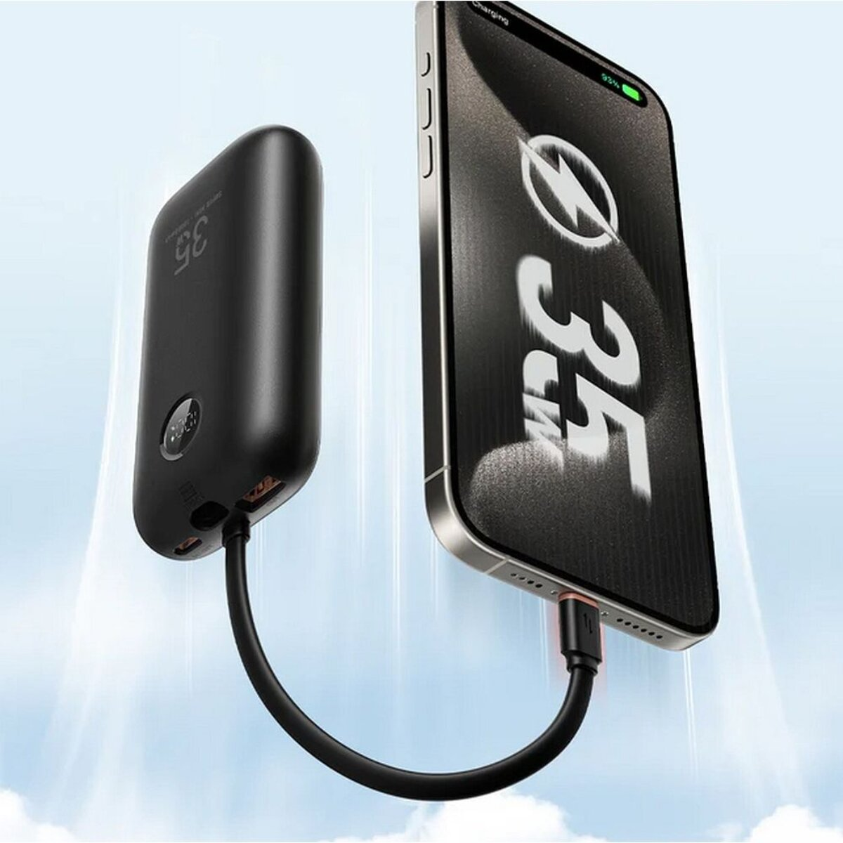 Schwarzes Ladekabel verbindet ein Smartphone mit einem Powerbank.