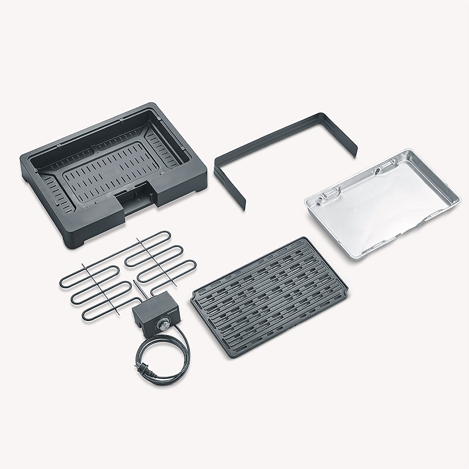 An electric grill and its parts: A dark base, a silver drip tray, a grill plate.