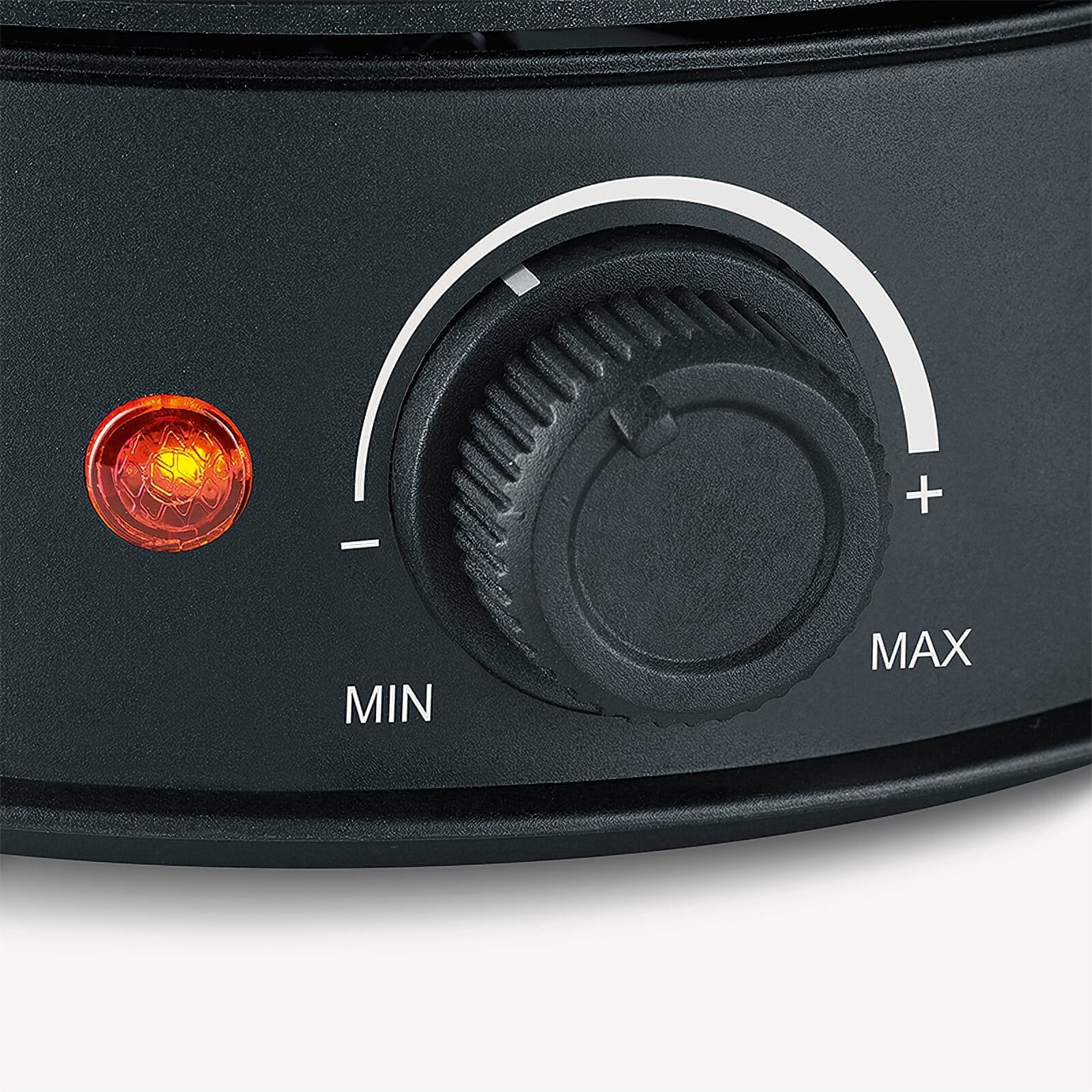 A black rotary knob with MIN and MAX markings, next to a red indicator light.