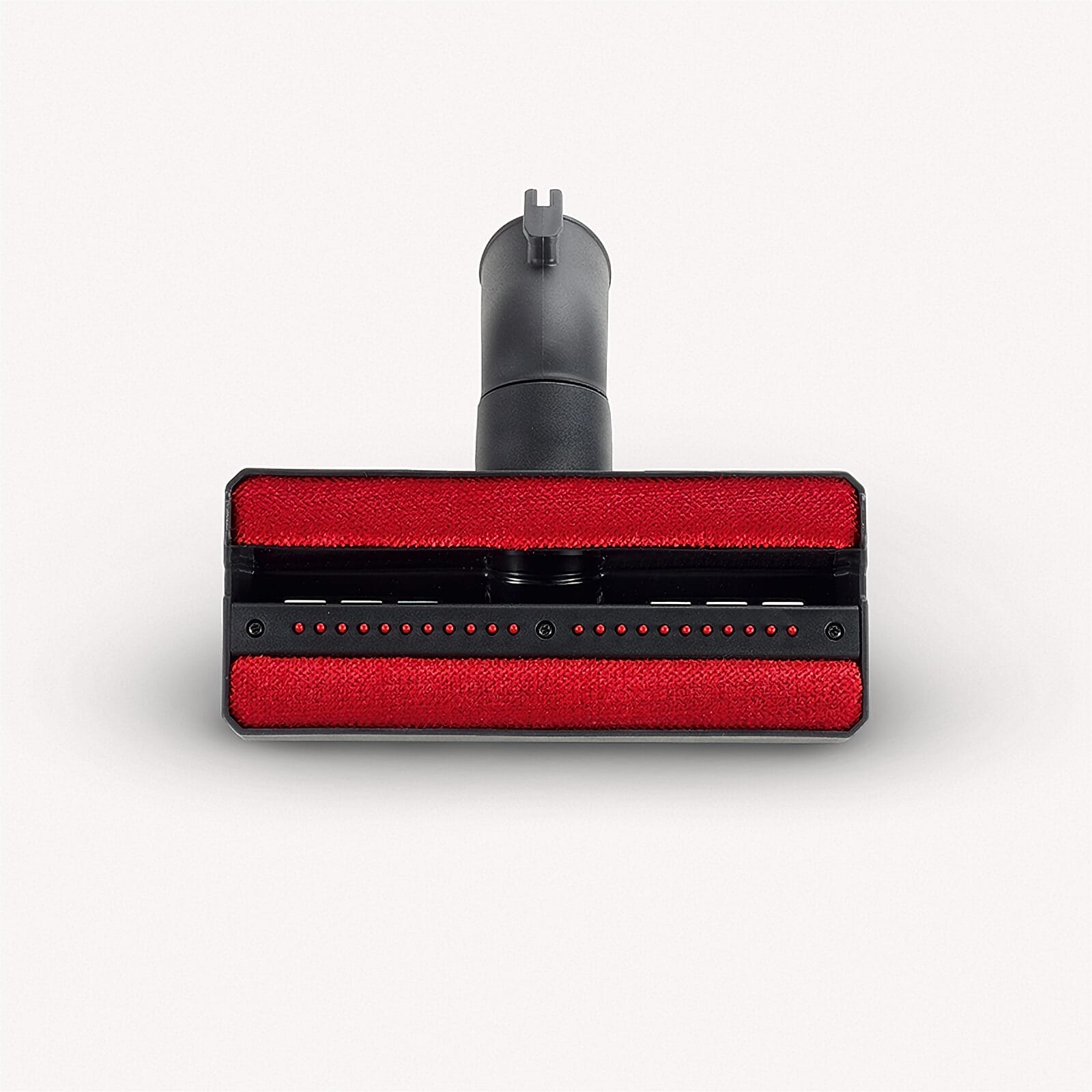 Czarna końcówka odkurzacza z czerwonymi szczotkami i złączem węża.