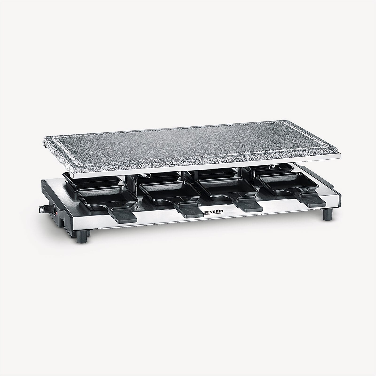 A silver raclette grill with a granite top and four pans.