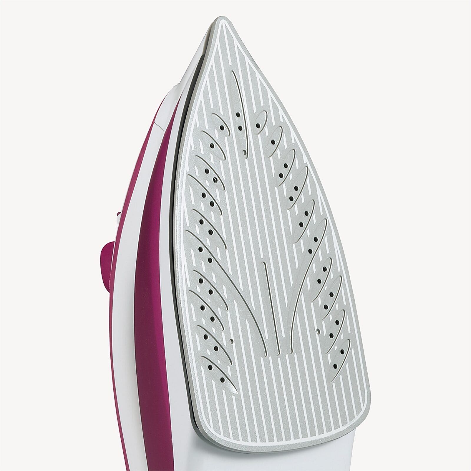Close-up of an iron's soleplate with vents and stripes.