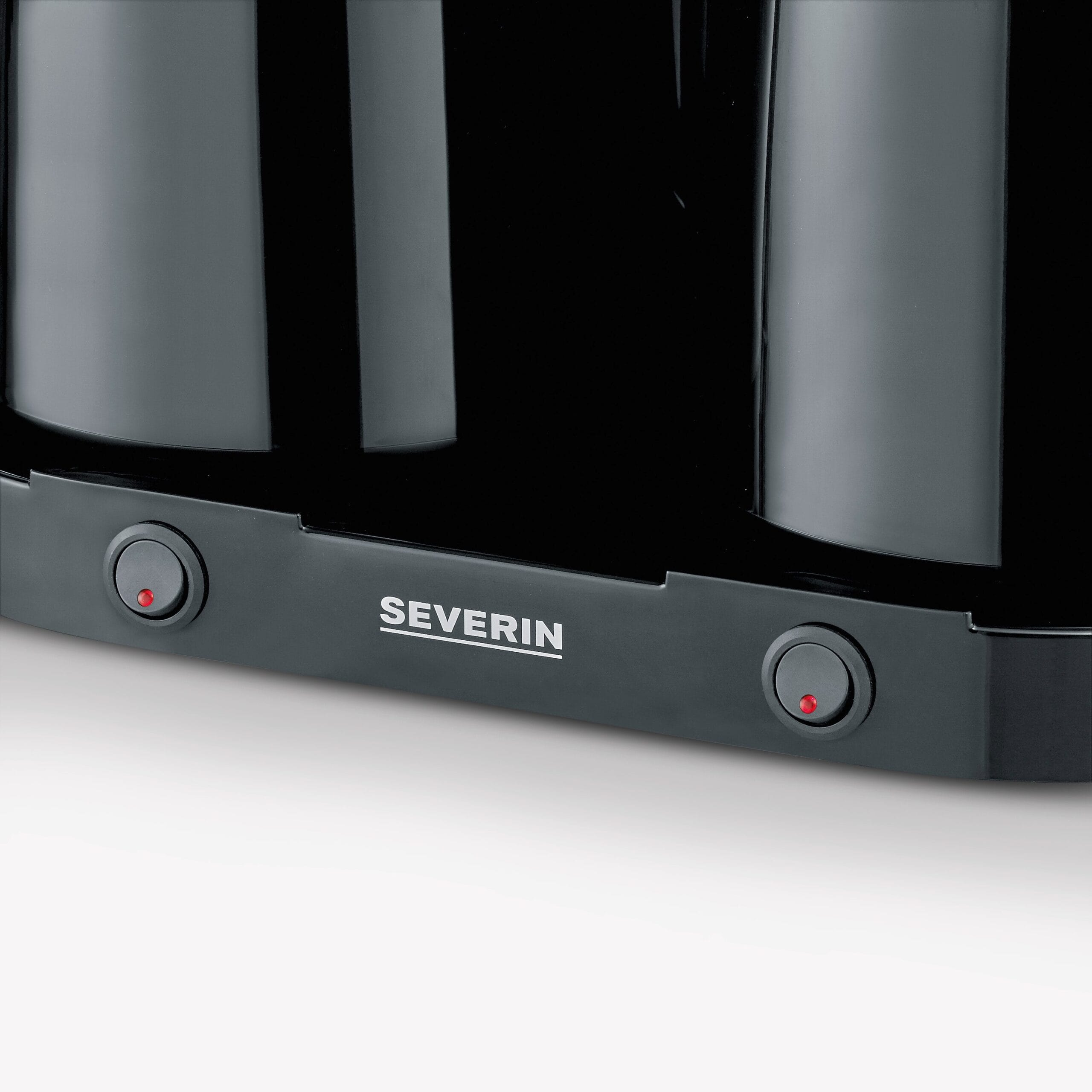 Czajnik czarny z dwoma przełącznikami, jeden świeci na czerwono.