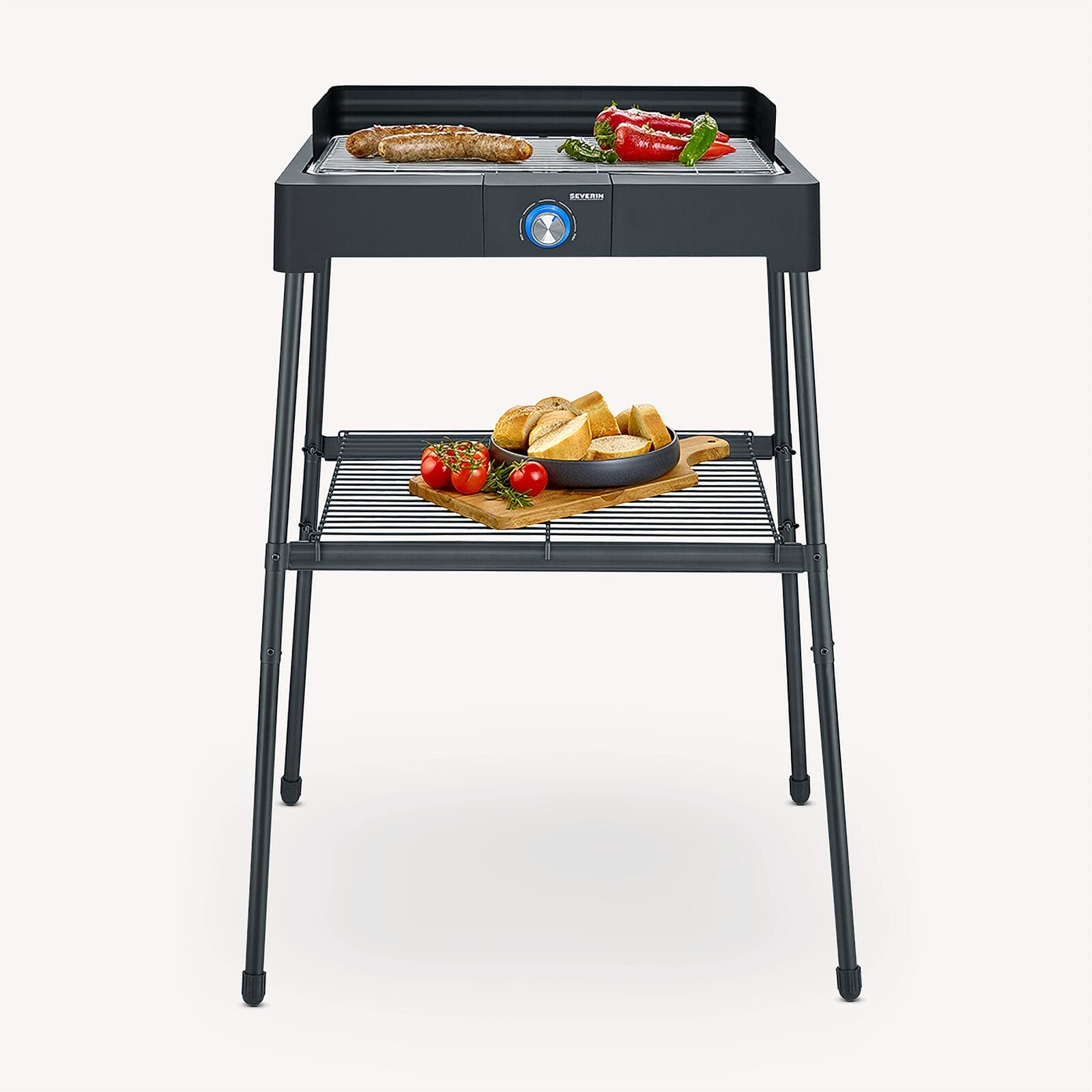 A dark grill with sausages and peppers on top, bread and tomatoes below.