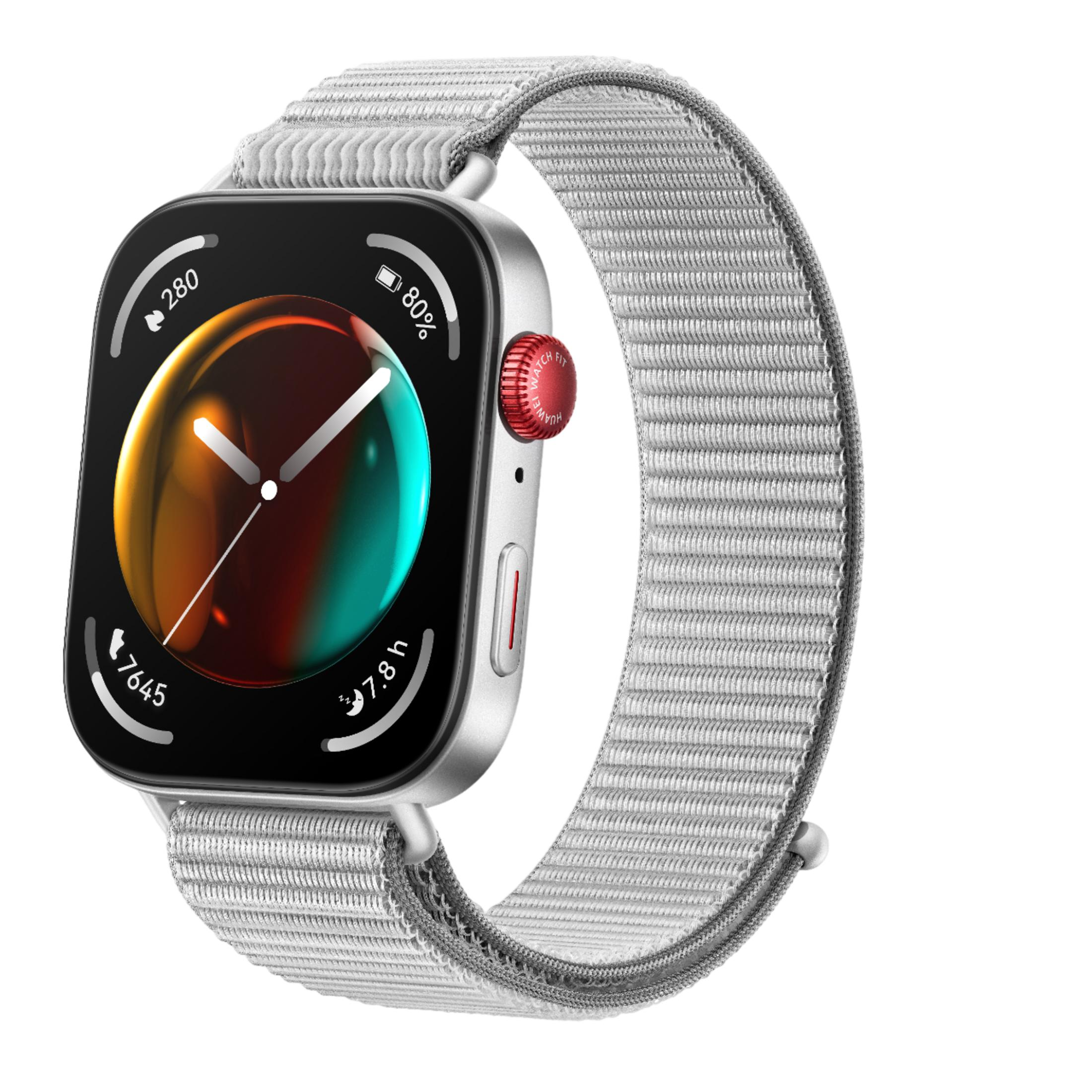 Srebrny smartwatch z szarą opaską materiałową i kolorową tarczą.