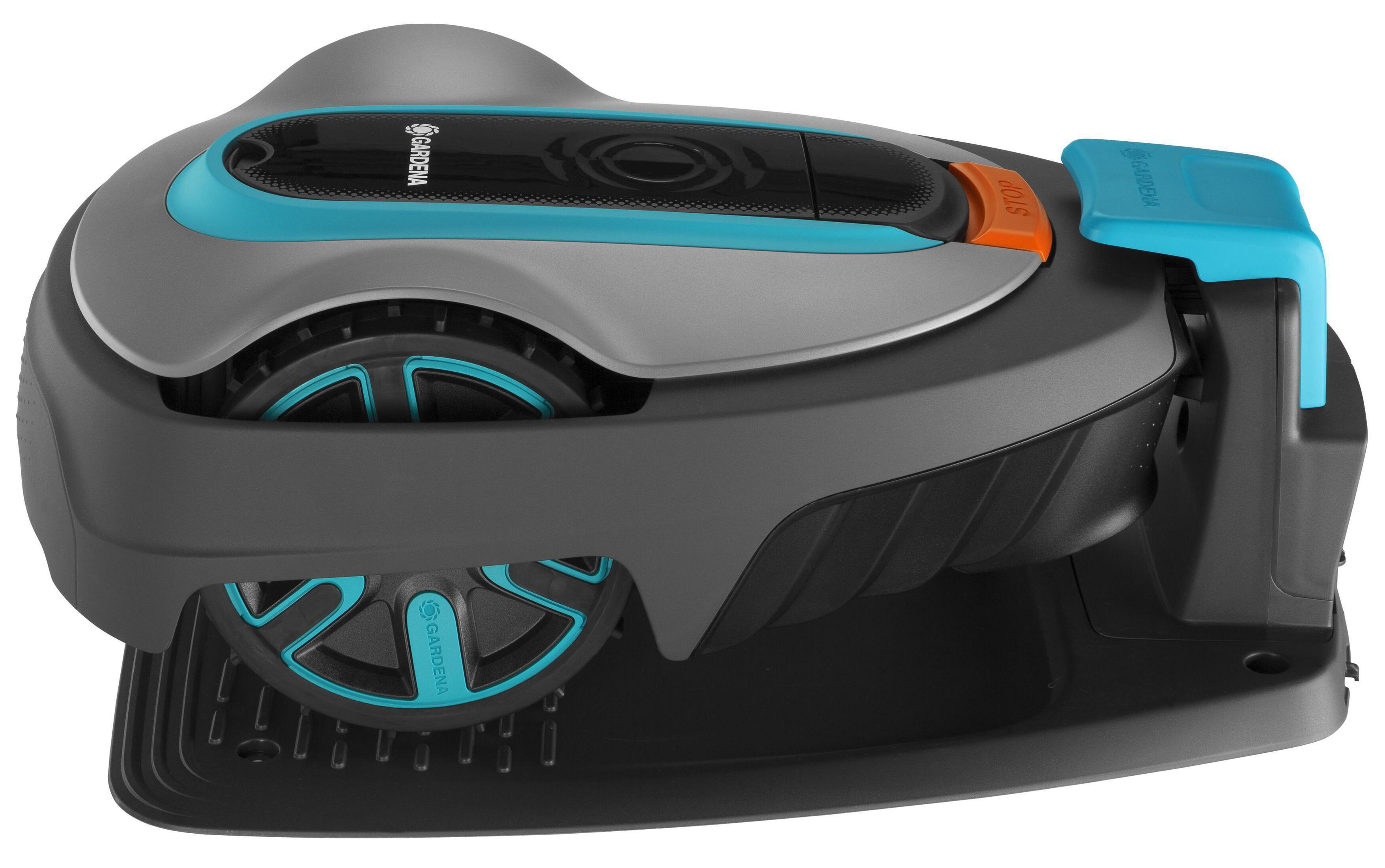 Szara i turkusowa kosiarka automatyczna z kołami i pomarańczowym przyciskiem stop.