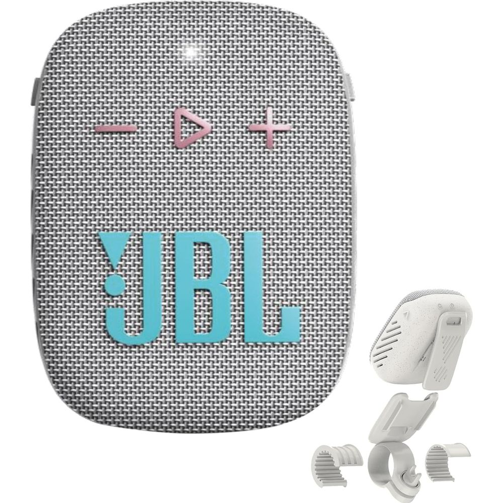 Un altoparlante JBL grigio con pulsanti blu e accessori.